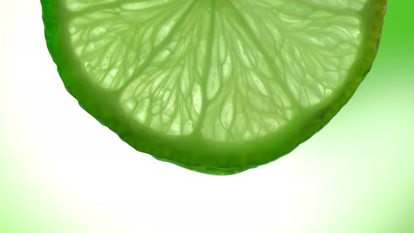 Fresh Slice Lime, a Drop of Water Falls. The Fruit Gives Off Freshness and Juice Filling