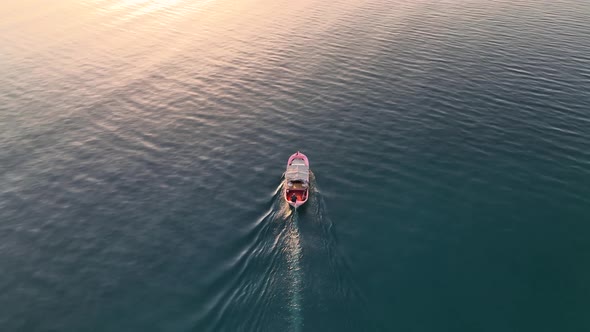 Sunrise Fishing boat goeas to sea aerial view Turkey Alanya 4 K