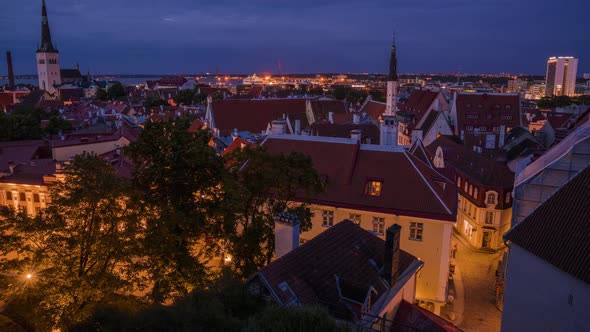 Time lapse view of the old town of Tallinn at night. Beautiful dusk light over the city in Estonia.