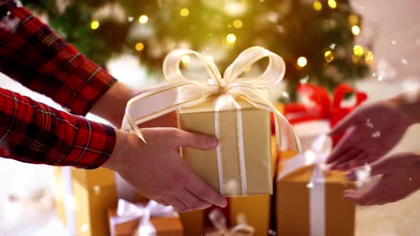 Couple with Gift Box on Christmas at Home