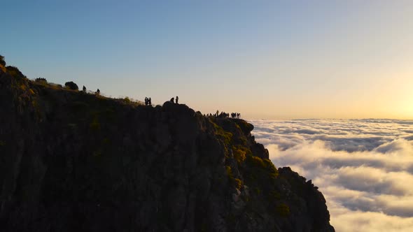 Mountain top of Pico do Arieiro on Madeira island Portugal and silhouettes of many tourists watching