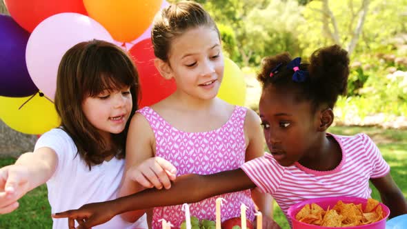 Kids counting a food item in park