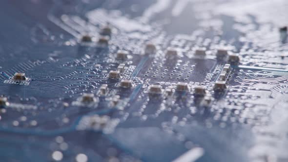 Computer Electronic Circuit Board with Radial Conductor Tracks and SMD Capacitors Rotating Macro