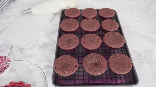 Time lapse. Step by step. Frosting red velvet cupcakes with cream cheese frosting.