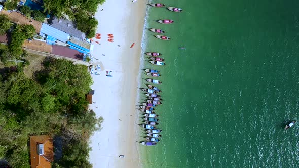 Aerial dolly zoom of docked long tail boats at Railay Beach, Ao Nang, Krabi, Thailand