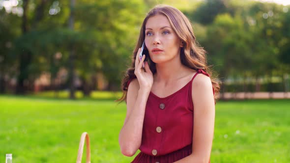 Woman Calling on Smartphone on Picnic at Park