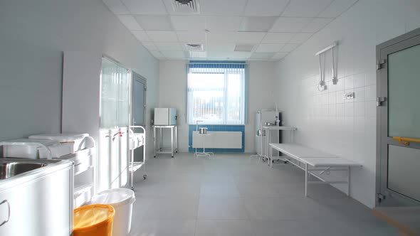 Different Equipment and Couch in Empty Examination Room