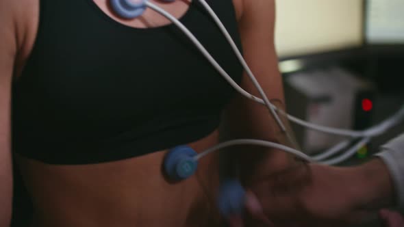 Doctor Placing Electrodes on Patient