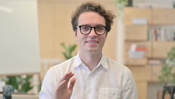 Portrait of Young Man Talking on Online Video Call