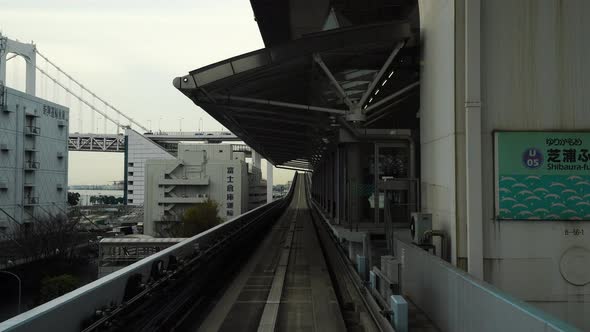 Scenery of a train traveling on the rail of Yurikamome Line in Tokyo
