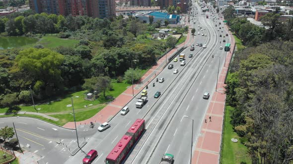 Traffic In Bogota - Vehicles And TransMilenio Articulated Bus Driving In City Road In Colombia. - st