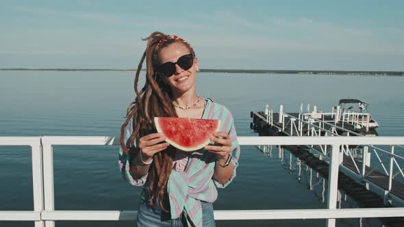 Girl Holding Piece of Watermelon