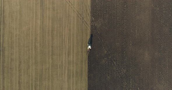 Tractor Plowing Field Aerial Shot of Agriculture