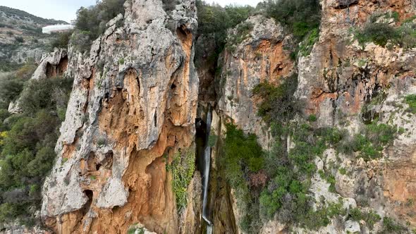 Waterfall in the mountains aerial view 4 K