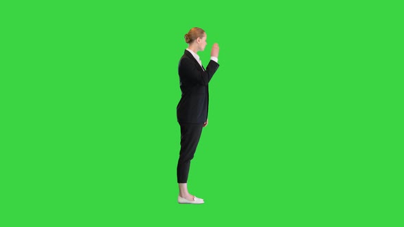 Young Business Woman Standing Doing Nothing on a Green Screen Chroma Key