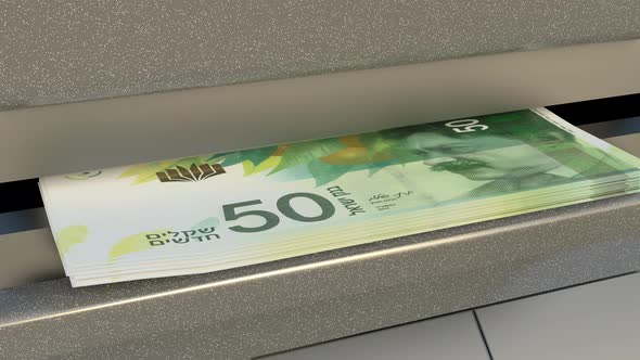 50 Israeli shekels in cash dispenser. Withdrawal of cash from an ATM.