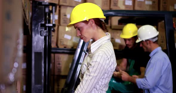 Warehouse manager scanning barcodes on boxes