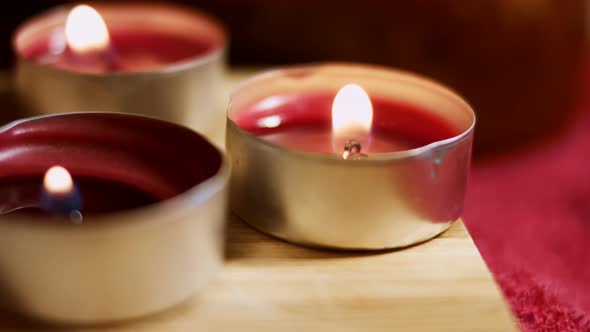 Three Burning Tea Lights Candles