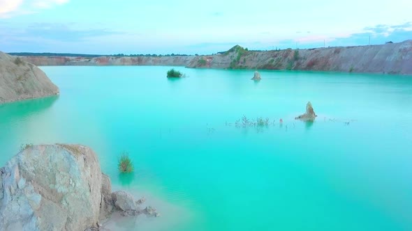 An artificial lake in chalk quarry. view from drone. Turquoise water background