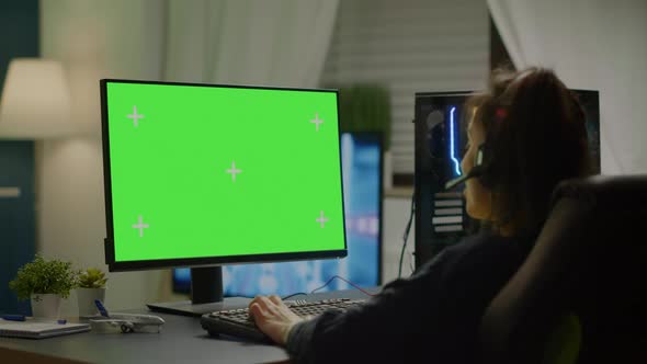 Pro Gamer Playing Virtual Video Game on Computer with Green Screen