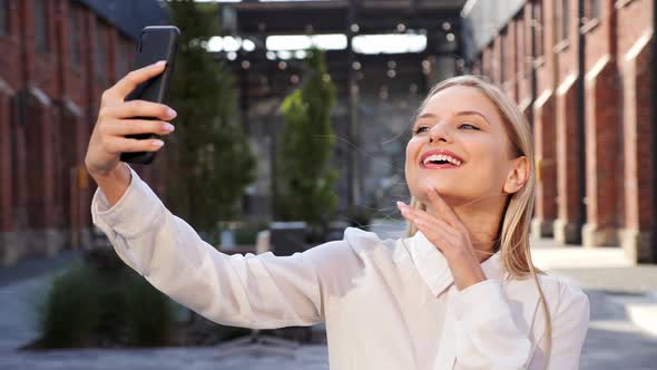 Cheerful Woman Making Selfie Photos Having Fun Video Chat Using Smartphone