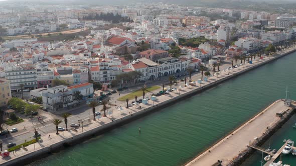 Aerial Drone Flying Above Sea Water Cannal in Lagos Harbor Portugal Dolly in Day