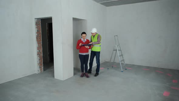Client and Contractor Discussing Renovation Work