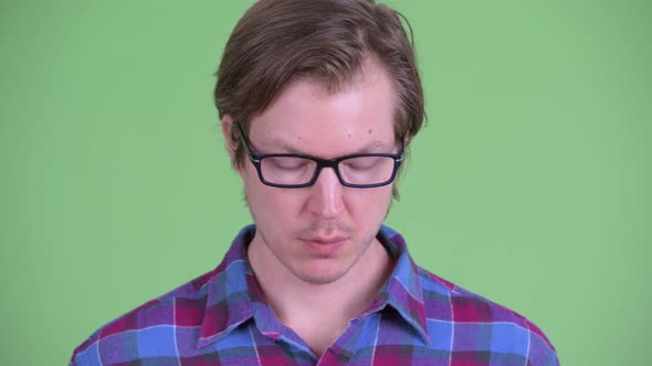 Face of Stressed Young Hipster Man Looking Down