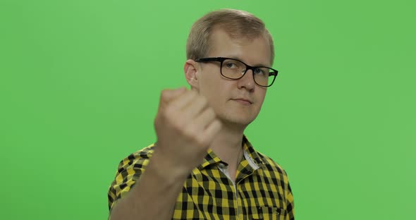 Handsome Young Man in Yellow Shirt Doing Doing Coming Gesture. Chroma Key