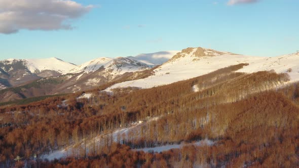 Aerial view at the mountain on a sunny winter day