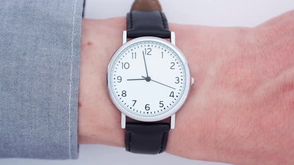 Close up of a man wearing a wrist watch