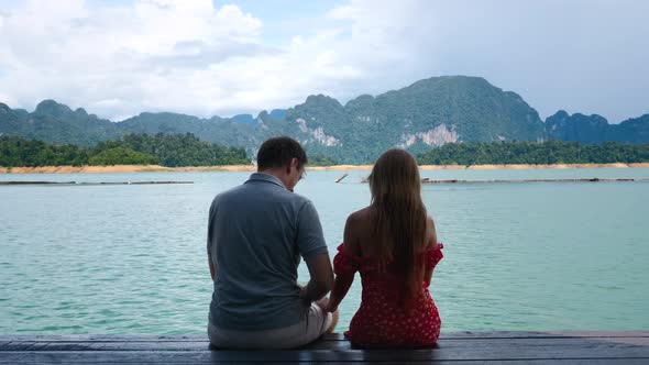 Rear View of Happy Romantic Couple Sit Together on Anniversary Date in Nature