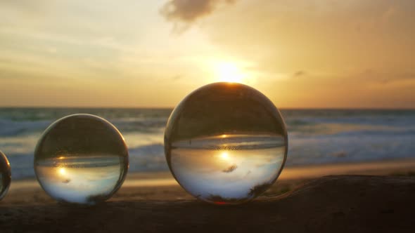 Three Crystal Balls On A Timber At Karon Beach Phuket.