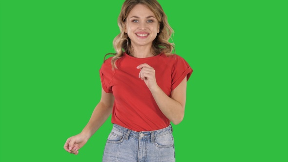 Running girl wearing red t-shirt and jeans Smiling on a