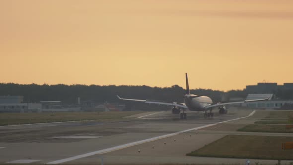 Airplane Landing at the Early Morning