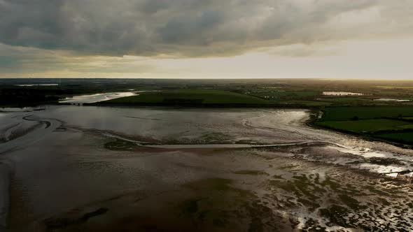 Drone rising over textured Irish landscape