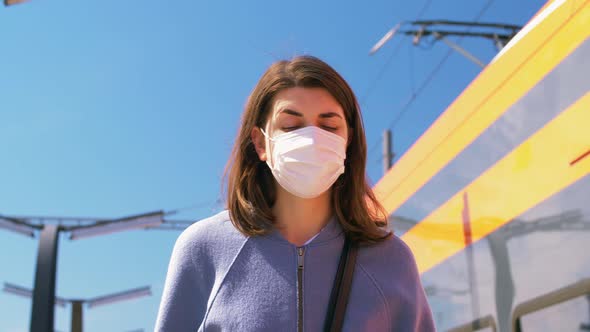 Woman in Protective Face Mask at Railway Station