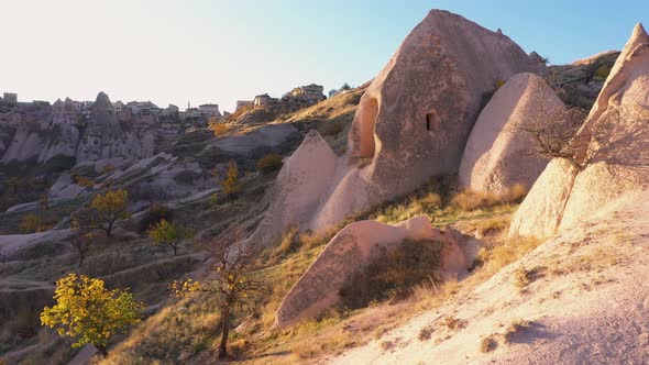 View of Cave Houses in Goreme City at Sunset.
