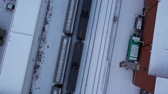 Train oil trailers City downtown Calgary winter snow tilt