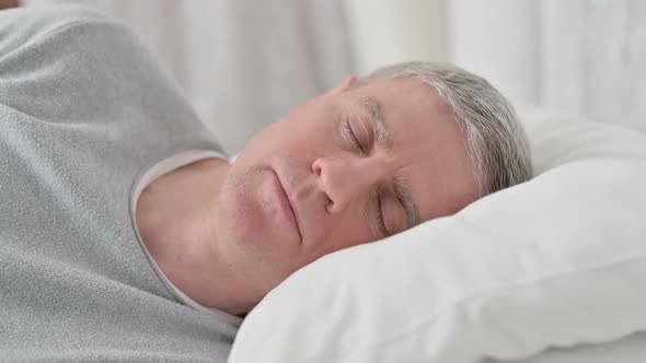 Close Up of Peaceful Old Man Sleeping in Bed