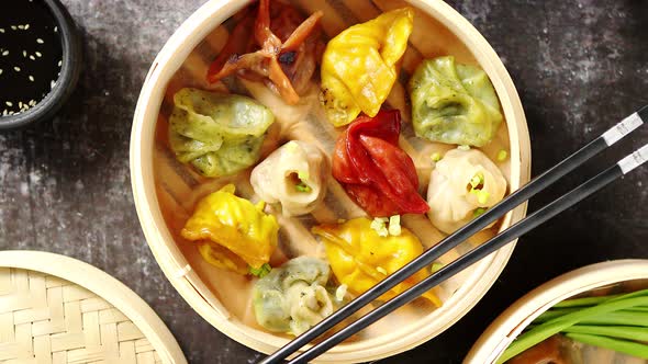 Oriental Traditional Chinese Dumplings Served in the Wooden Steamer