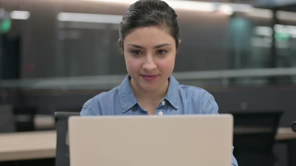 Close Up of Successful Indian Woman Celebrating on Laptop