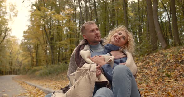 Loving Couple in Jeans on a Date in the Autumn Park