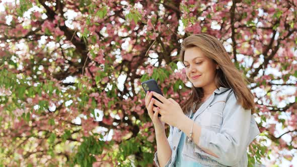 Cheerful Girl With Smartphone