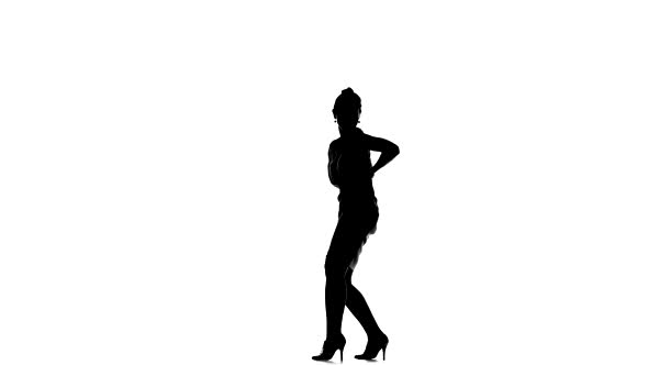 Attractive Social Latina Dancer in Skirt Starting Dancing, Stands Sideways, on White, Silhouette