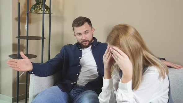 Unhappy Caucasian Couple Sit Waiting for Therapy Session with Psychologist