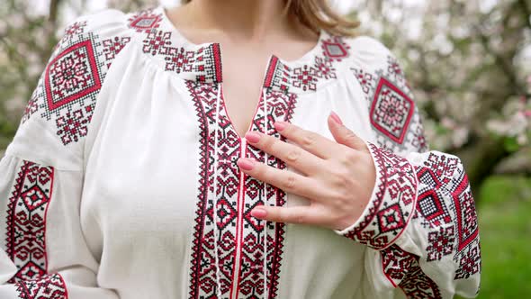 Woman Demonstrates Beautiful Details of Embroidery Ornament on Vyshyvanka Dress