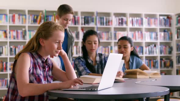 Schoolkids studying in library 4k