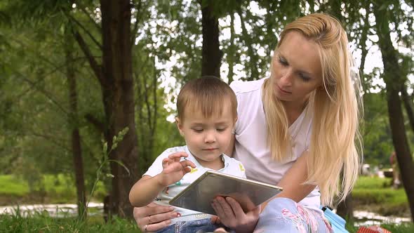 Woman and Child Using Tablet Computer