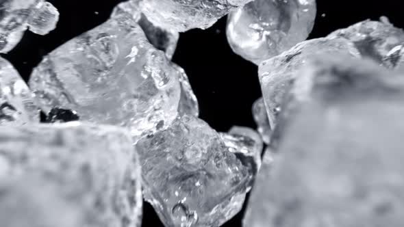 Super Slow Motion Shot of Falling Ice Cubes on Black Background at 1000Fps